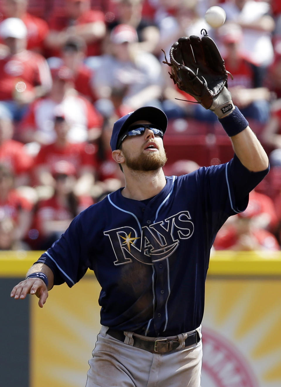 Tampa Bay Rays second baseman Ben Zobrist catches a pop fly hit by Cincinnati Reds' Chris Heisey in the eighth inning of a baseball game, Saturday, April 12, 2014, in Cincinnati. Tampa Bay won 1-0. (AP Photo/Al Behrman)