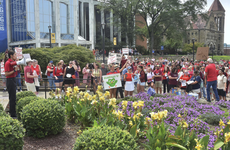 Students gather during a walkout in protest of an administration proposal to cut 9% of majors and amid a $45 million budget shortfall at West Virginia University in Morgantown, W.Va., Monday, Aug. 21, 2023. (Ron Rittenhouse /The Dominion-Post via AP)