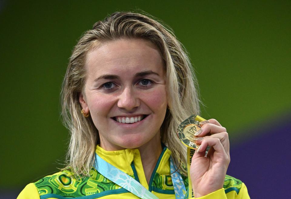 Australia's Ariarne Titmus (pictured) celebrates with her gold medal at the Commonwealth Games.