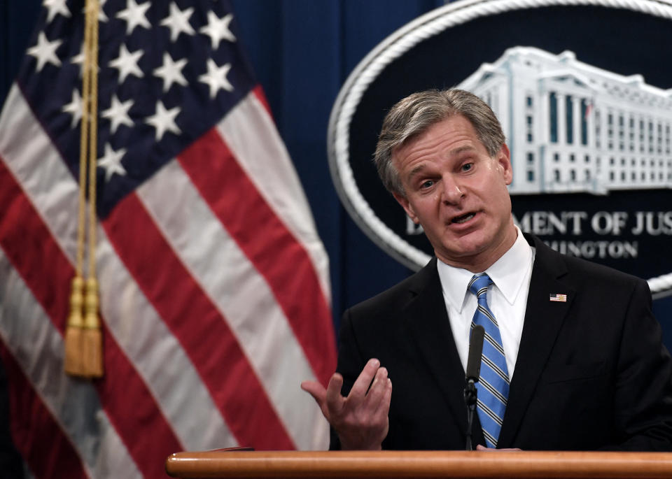 FBI Director Christopher Wray speaks during a news conference over ransomware cyberattack at the Department of Justice in Washington, DC on November 8, 2021. (Photo by Olivier DOULIERY / AFP)