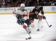 November 19, 2017; Anaheim, CA, USA; Florida Panthers right wing Evgenii Dadonov (63) moves the puck ahead of Anaheim Ducks defenseman Brandon Montour (26) during the first period at Honda Center. Gary A. Vasquez-USA TODAY Sports