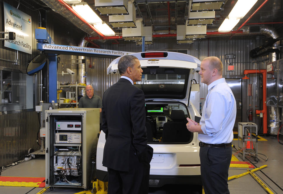 President Barack Obama is briefed about an electric car by researcher Henning Lohse-Busch as he tours the Argonne National Laboratory in Argonne, Illinois, on March 15, 2013, before speaking on American energy.