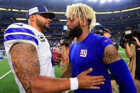 Dak Prescott of the Cowboys greets Odell Beckham Jr. in 2018.