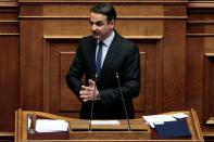 Greek conservative New Democracy party leader Kyriakos Mitsotakis addresses lawmakers during a parliamentary session before a vote on setting up a special committee which will probe the role of ten politicians in a case which involves alleged bribery by Swiss drugmaker Novartis, in Athens, Greece, February 21, 2018. REUTERS/Alkis Konstantinidis