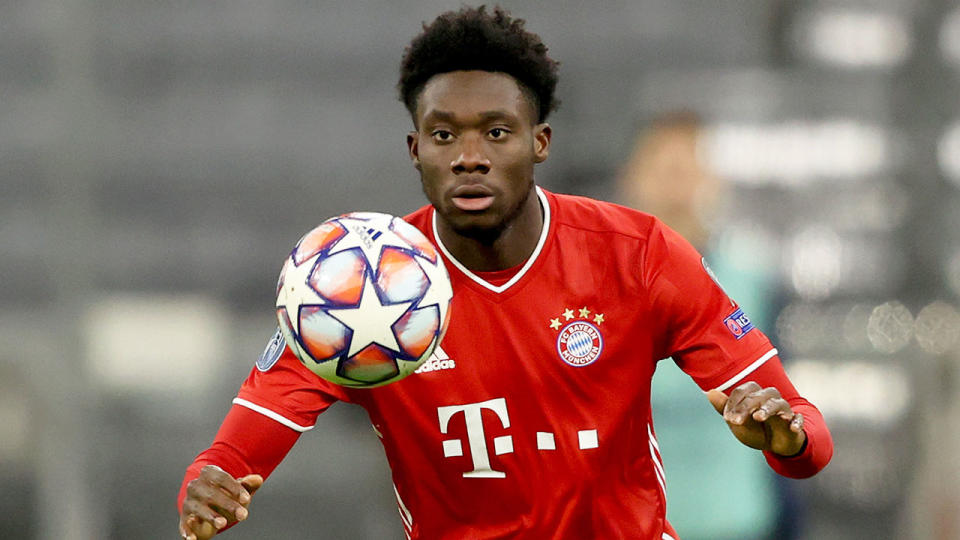 Pictured here, Bayern Munich star Alphonso Davies prepares to control a ball during a match.