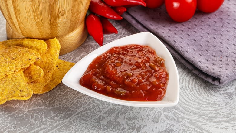Spicy red salsa in dish