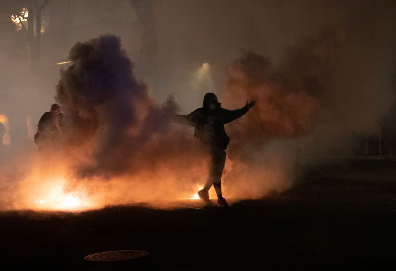 Federal law enforcement officers deployed under the Trump administration's executive order face off with protesters