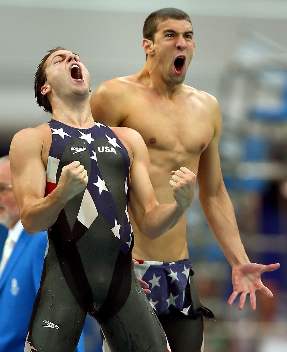 (L-R) Garrett Weber-Gale and Michael Phelps of the United States celebrate finishing the Men's 4 x 100m Freestyle Relay Final in first place to win the gold medal held at the National Aquatics Center on Day 3 of the Beijing 2008 Olympic Games on August 11, 2008 in Beijing, China.The United States finished the race in first place in a time of 3:08.24 and wins the gold medal and set a new World Record. (Photo by Mike Hewitt/Getty Images)