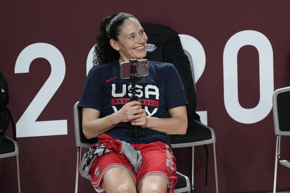 United States' Sue Bird uses her phone to take video of teammates during a women's basketball practice at the 2020 Summer Olympics, Saturday, July 24, 2021, in Saitama, Japan. (AP Photo/Eric Gay)