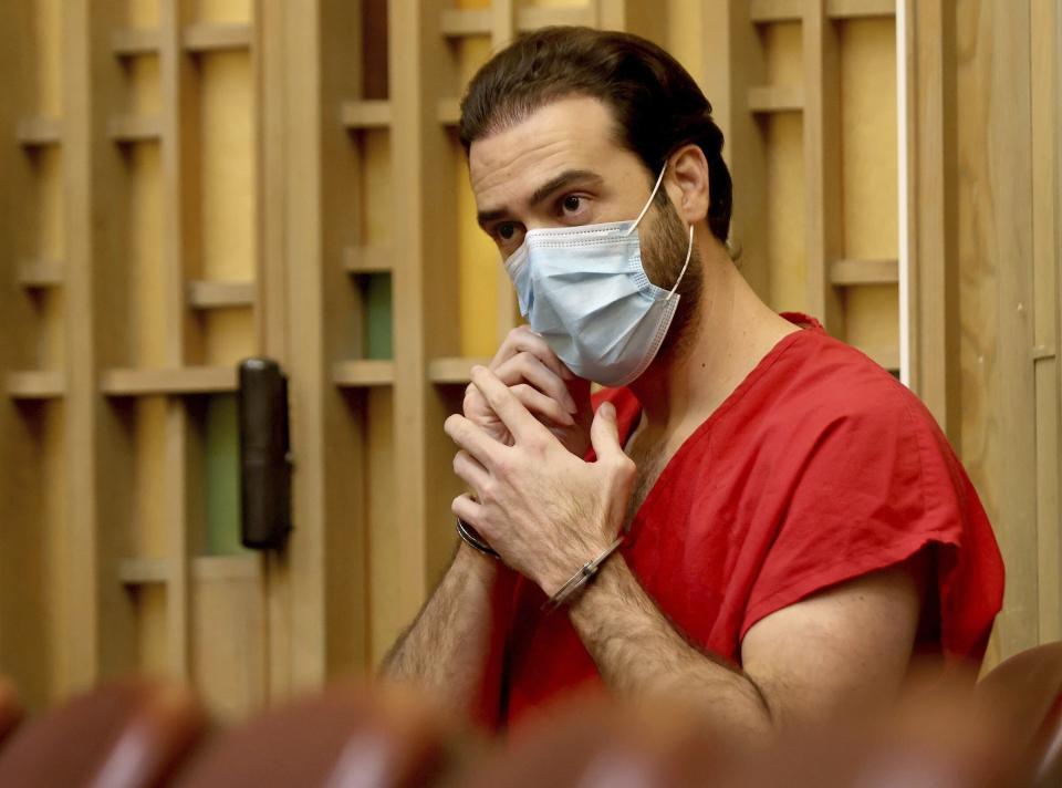Mexican actor Pablo Lyle adjust his mask as he appears in the courtroom of Judge Maria Tinkler Mendez who later ruled against his request of a new trial as his family, lawyers, and members of the media gathered in Courtroom 4-6 at the Richard E. Gerstein Justice Building in Miami, Florida on Monday, December 12, 2022. (Carl Juste/Miami Herald via AP)