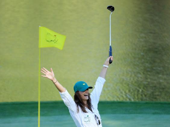 Chelsie Joce, girlfriend of Matt Wallace, celebrates making a putt during the Par-Three (Getty)