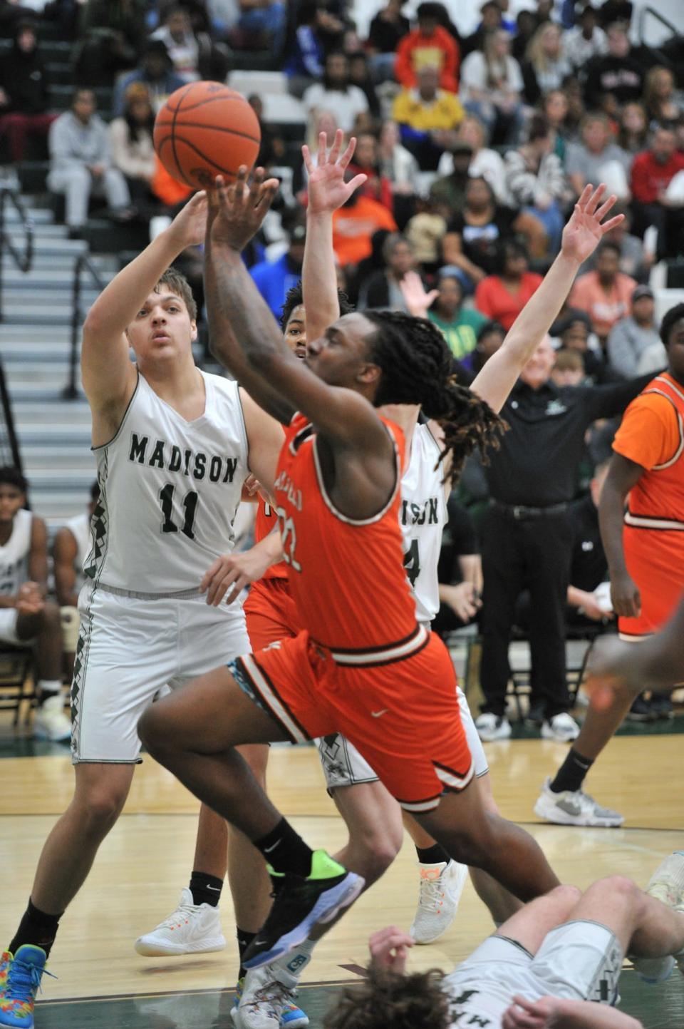 Mansfield Senior's Elias Owens drives to teh basket during the Tygers' win over Madison on Friday night.