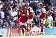 Arsenal's Gabriel Jesus, left, celebrates scoring their side's first goal of the game with team-mates Oleksandr Zinchenko and Granit Xhaka, right, during their English Premier League soccer match at the Emirates Stadium, London, Saturday, Aug. 13, 2022. (Mike Egerton/PA via AP)