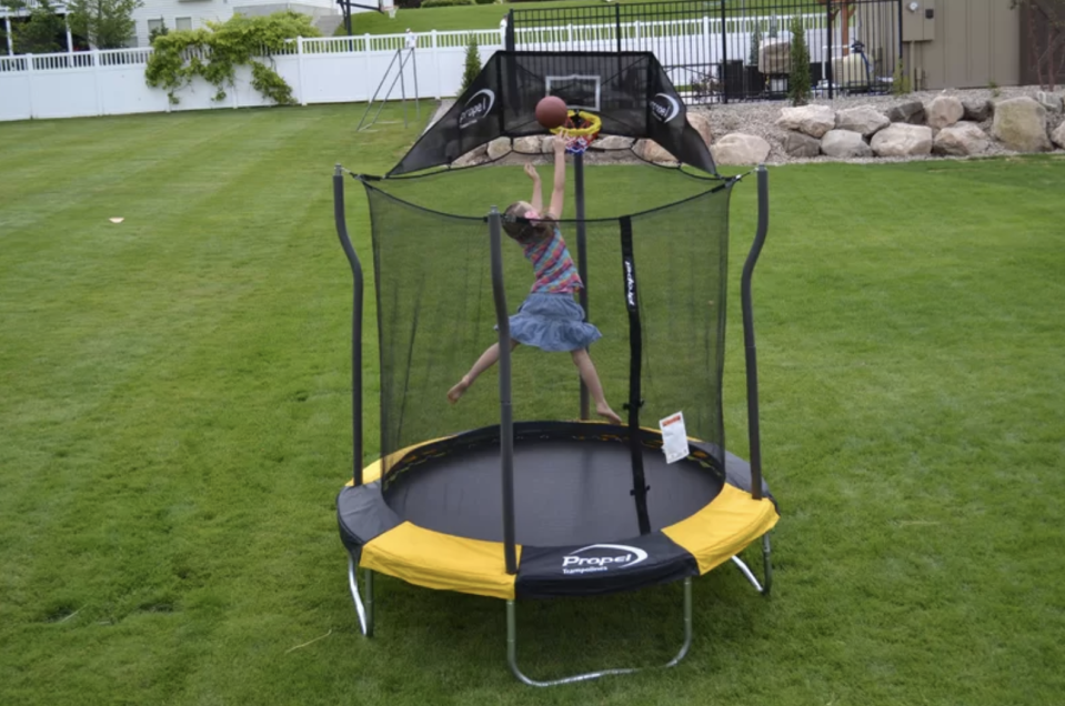 The trampoline even comes with a basketball hoop for budding athletes. (Photo: Wayfair)