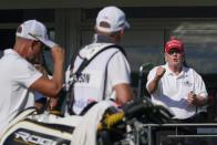 Former President Donald Trump gestures toward Henrik Stenson, who was leaving the 16th tee during the second round of the LIV Golf Invitational tournament in Bedminster, N.J., Saturday, July 30, 2022. (AP Photo/Seth Wenig)