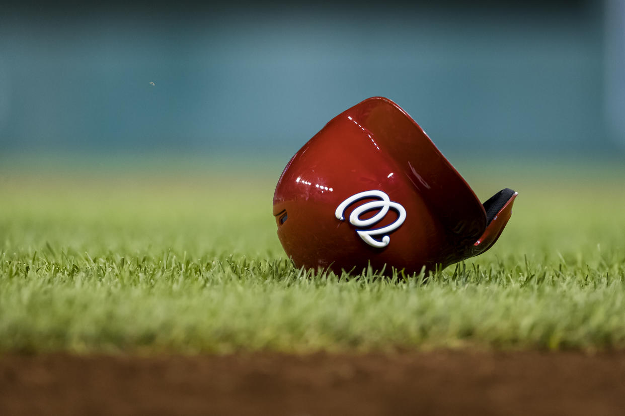 WASHINGTON, DC - AUGUST 17: The helmet of Juan Soto #22 of the Washington Nationals (not pictured) on the grass during the twelfth inning of a game against the Milwaukee Brewers at Nationals Park on August 17, 2019 in Washington, DC. (Photo by Scott Taetsch/Getty Images)