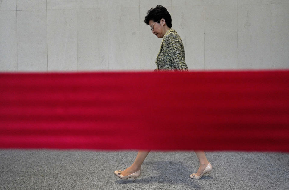 Hong Kong Chief Executive Carrie Lam arrives at a press conference at the government building in Hong Kong Tuesday, Sept. 24, 2019. The Beijing-backed leader is hoping to tone down increasingly violent protests ahead of China’s National Day celebrations on Oct. 1. The unrest was sparked by an extradition bill that has now been withdrawn but protesters now demand greater democracy. (AP Photo/Vincent Yu)