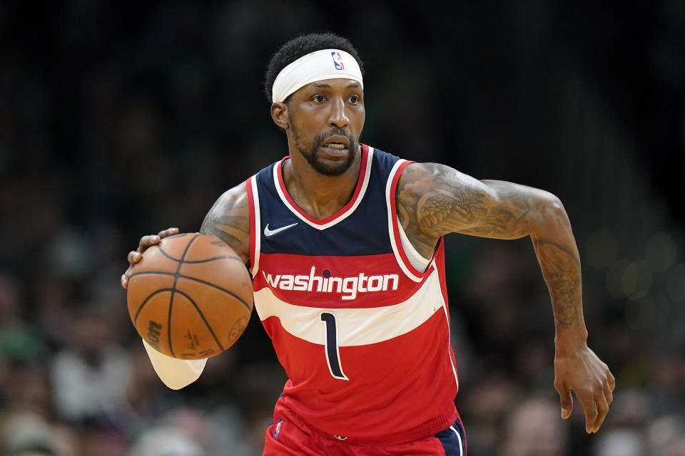 FILE - Washington Wizards guard Kentavious Caldwell-Pope (1) plays in the second half of an NBA basketball game against the Boston Celtics, Sunday, April 3, 2022, in Boston. The Denver Nuggets have agreed to a deal that would send guards Will Barton and Monte Morris to the Washington Wizards for Kentavious Caldwell-Pope and Ish Smith, a person with knowledge of the negotiations said Wednesday, June 29, 2022. (AP Photo/Steven Senne, File)