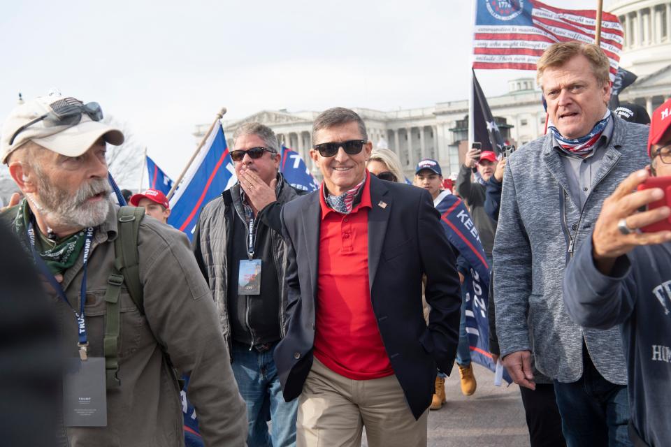 Patrick Byrne, former CEO of Overstock, seen on the right, stands at the front of the Supreme Court on Dec. 12, 2020, to speak to Donald Trump supporters protesting alleged voter fraud in the presidential election. In the center is Gen. Michael Flynn. Both are Sarasota County residents.