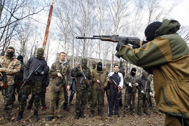 An instructor with the Ukrainian volunteer Azov Battalion conducts training exercises for the civilian population of Kiev on March 1, 2015