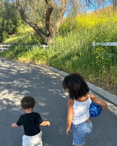 <p>Kylie Jenner Instagram</p> Kylie Jenner's children, daughter Stormi and son Aire, walk together.