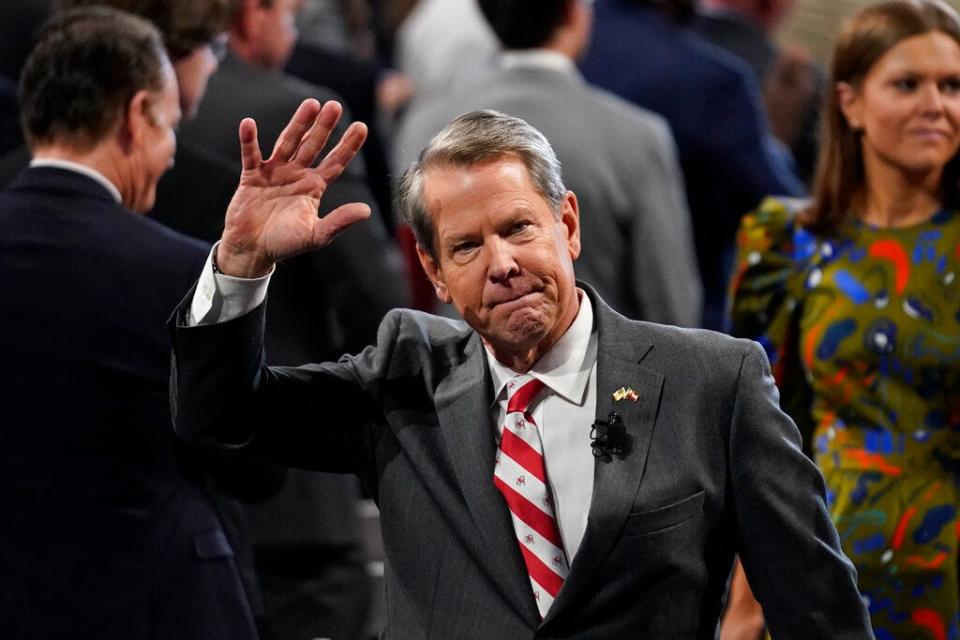 FILE - Gov. Brian Kemp waves to guests as he leaves after being sworn in as Georgia's Governor during a ceremony on Thursday, Jan. 12, 2023, in Atlanta. In his State of the State speech on Jan. 25, 2023, Kemp said workforce development is need to keep Georgia in top spot to do business. (AP Photo/Brynn Anderson)