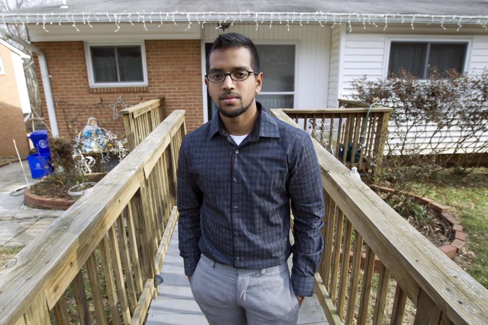 Yves Gomes, a student at the University of Maryland, who's parents were deported, poses for a photo outside his great uncle's house where he lives in Silver Spring, Md., Friday Jan. 17, 2014. Gomes says he considers himself one of the lucky ones _ lucky, at least, among the so-called “DREAMers.” Even though his parents were deported and his legal status was once in limbo, today the 21-year-old Indian native attends the University of Maryland paying in-state tuition. ( AP Photo/Jose Luis Magana)