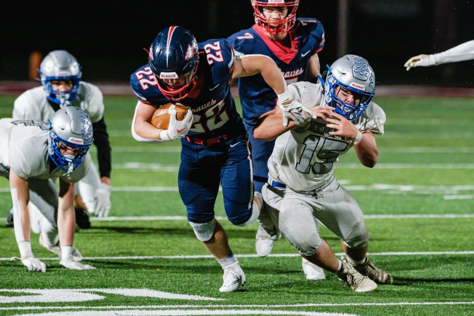 Indian Valley's Grady Kinsey breaks the tackle attempt by Bishop Ready's Kasen Abbott during the Division IV Region 15 Semifinal football game, Saturday, Nov. 12 from Paul “Hoss” Starr Stadium in Newark.