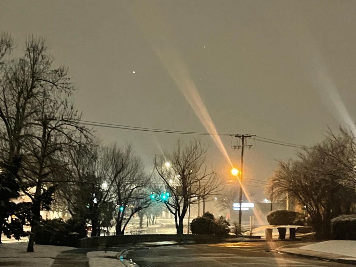 Snow falling Sunday night near Uptown Oklahoma City
