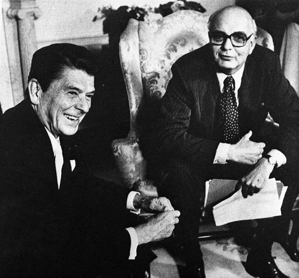 Federal Reserve Chairman Paul Volcker (right) speaks with President Ronald Reagan in the Oval Office in Washington, DC, on July 16, 1981. Mr. Volcker briefed a Congressional committee on President Reagan's visit to Canada the following week.  (AP Photo/Apple White)