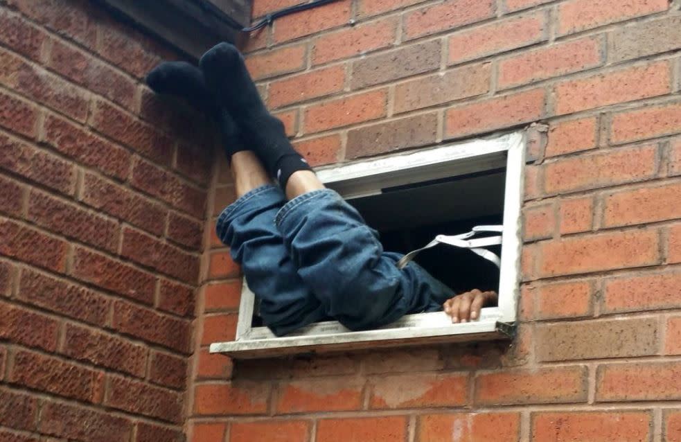 Going nowhere. The burglar got stuck in an extraction fan (West Midlands Police)