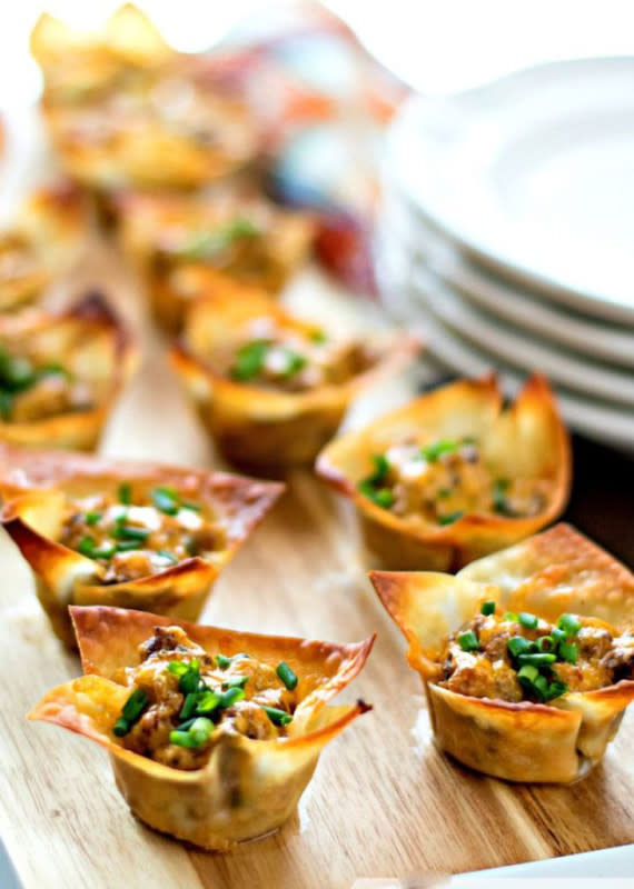 <p>Melissa's Southern Style Kitchen</p><p>Here, mini wontons are filled with sausage, cream cheese, chives, cheddar cheese and Dijon mustard, the last ingredient gives the filling just enough kick. </p><p><strong>Get the recipe:</strong> <a href="https://www.melissassouthernstylekitchen.com/cheesy-dijon-sausage-cups/" rel="nofollow noopener" target="_blank" data-ylk="slk:Cheesy Dijon Sausage Cups;elm:context_link;itc:0;sec:content-canvas" class="link rapid-noclick-resp"><strong>Cheesy Dijon Sausage Cups</strong></a></p>