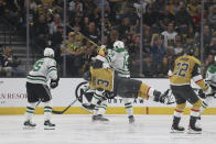 Dallas Stars left wing Jamie Benn (14) checks Vegas Golden Knights defenseman Brayden McNabb (3) during the first period in Game 4 of an NHL hockey Stanley Cup first-round playoff series Monday, April 29, 2024, in Las Vegas. (AP Photo/Ian Maule)