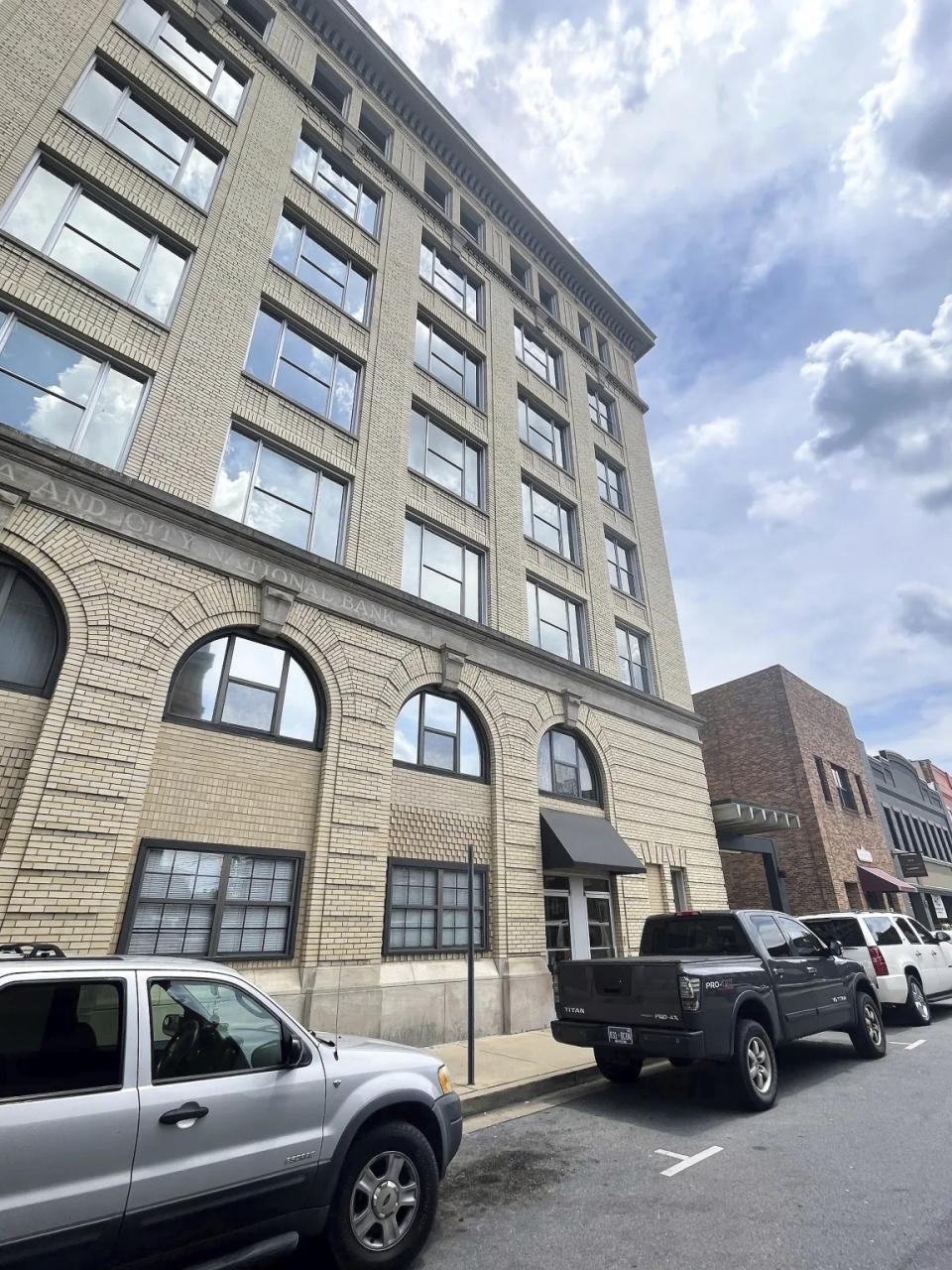 A woman identified as Jane Doe 1 in a lawsuit against the city of Johnson City, Tenn., survived a five-story plunge from this downtown Johnson City building on Sept. 19, 2020. She and other plaintiffs allege that city police officers took thousands of dollars from a local building contractor and obstructed investigations into allegations that he sexually assaulted many women. (WJHL via AP)