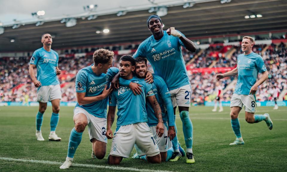 <span>Morgan Gibbs-White (centre) celebrates with teammates after giving Nottingham Forest a 1-0 victory at Southampton.</span><span>Photograph: Ritchie Sumpter/Nottingham Forest FC/Getty Images</span>