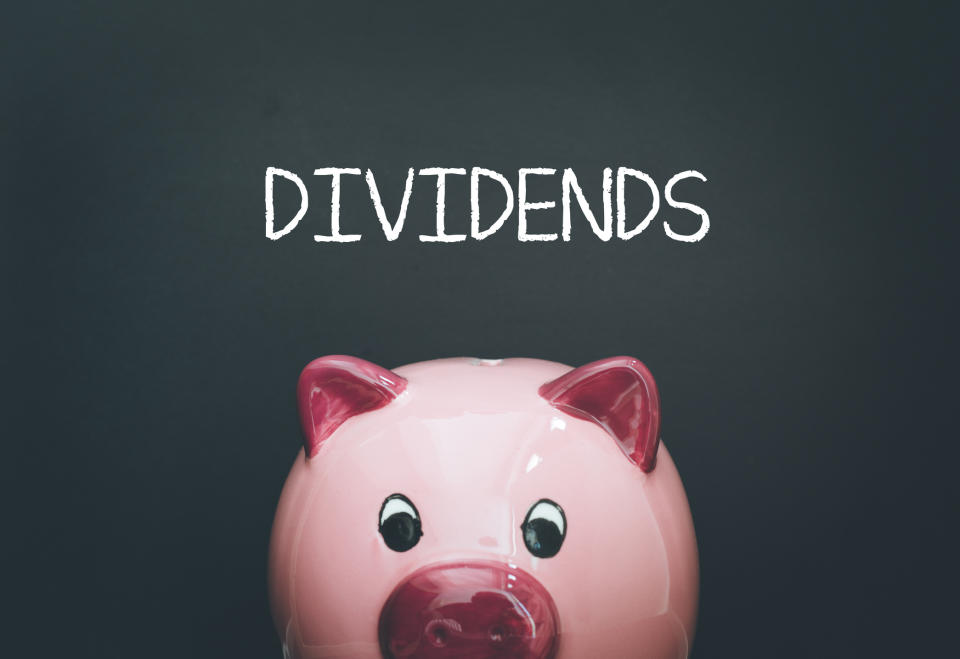 A piggy bank with the word DIVIDENDS written above it