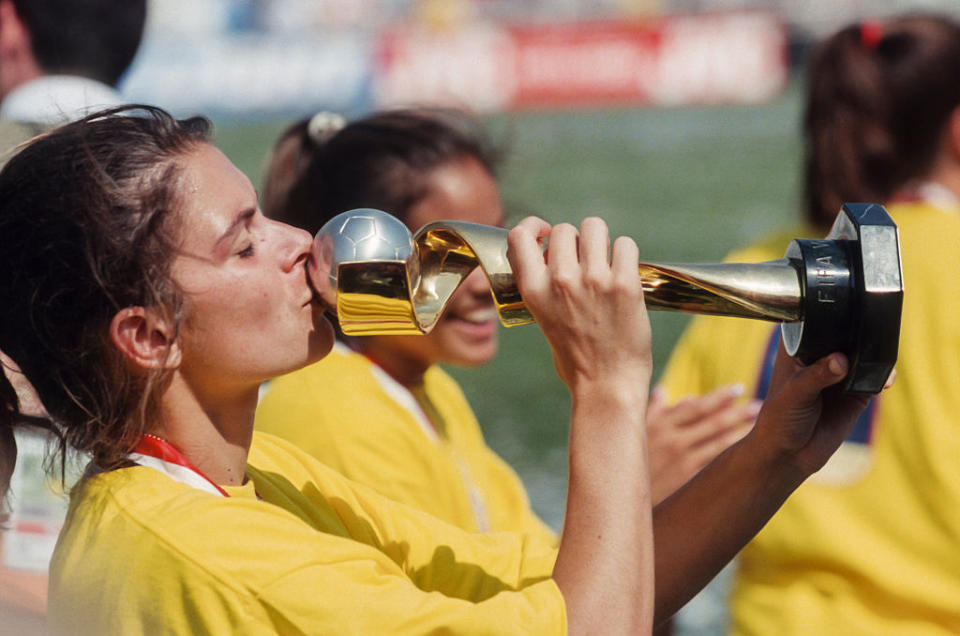 Mia Hamm, #9 of the USA, kisses the World Cup Trophy after the 1999 FIFA Women's World Cup final played against China on July 10, 1999 at the Rose Bowl in Pasadena, California. | David Madison—Getty Images
