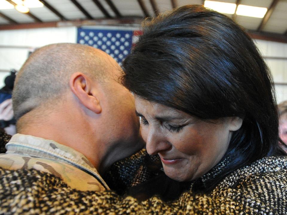Nikki Haley cries as she hugs her husband Michael Haley after his return from Afghanistan