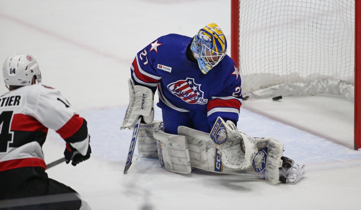 Devon Levi  made 30 saves Sunday, but the Amerks lost 4-3 in overtime to the Crunch.