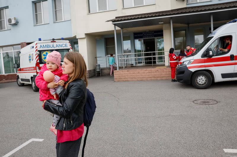 People evacuate hospital after authorities declare possible danger of Russian strike, in Kyiv