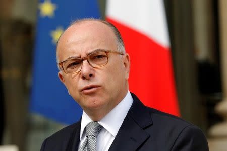 French Interior Minister Bernard Cazeneuve speaks about fires that hit the south of France, in the Elysee Palace courtyard at the end of a defence council in Paris, France, August 11, 2016. REUTERS/Philippe Wojazer