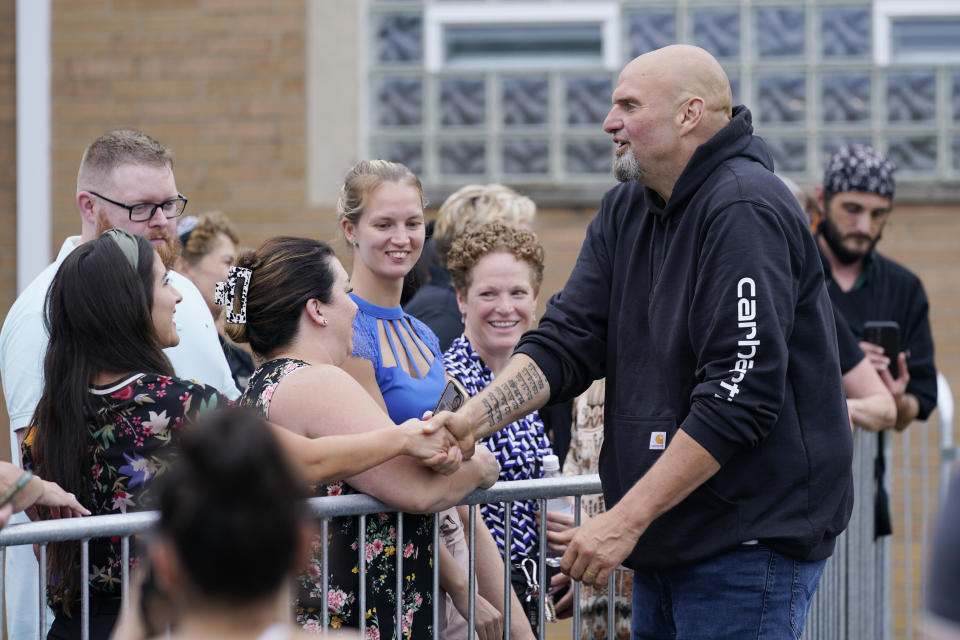 FILE - Democratic Pa. Lt. Gov. John Fetterman greets people at a United Steelworkers of America Local Union 2227 event in West Mifflin, Pa., Sept. 5, 2022. Fetterman has made abortion rights a prominent theme in the suburbs to invigorate female voters after the U.S. Supreme Court overturned Roe v. Wade in June. (AP Photo/Susan Walsh, File)