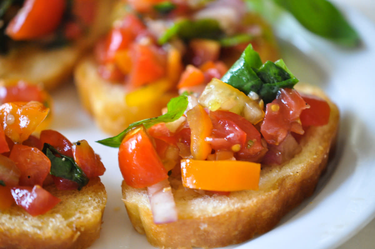 <p>Holly Clegg</p><p>A classic appetizer that is always a hit, this recipe includes balsamic vinegar for extra flavor.</p><p><strong>Get the recipe: <a href="https://parade.com/842669/hollyclegg/tomato-bruschetta-from-guys-guide-to-eating-well/" rel="nofollow noopener" target="_blank" data-ylk="slk:Tomato Bruschetta;elm:context_link;itc:0;sec:content-canvas" class="link rapid-noclick-resp">Tomato Bruschetta</a></strong></p><p><strong>Related: <a href="https://parade.com/1229527/kristamarshall/cherry-tomato-recipes/" rel="nofollow noopener" target="_blank" data-ylk="slk:35 Best Cherry Tomato Recipes;elm:context_link;itc:0;sec:content-canvas" class="link rapid-noclick-resp">35 Best Cherry Tomato Recipes</a></strong></p>