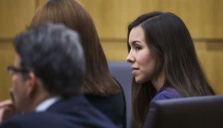 Jodi Arias (R) looks at her attorneys during the sentencing phase retrial in Phoenix March 3, 2015. REUTERS/Tom Tingle/Pool