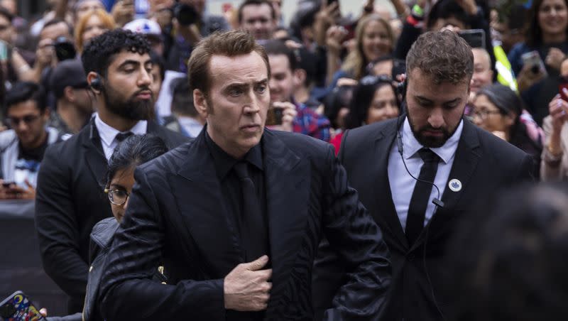 Nicolas Cage greets fans as he attends the premiere of “Dream Scenario” at the Toronto International Film Festival on Sept. 9, 2023, in Toronto.