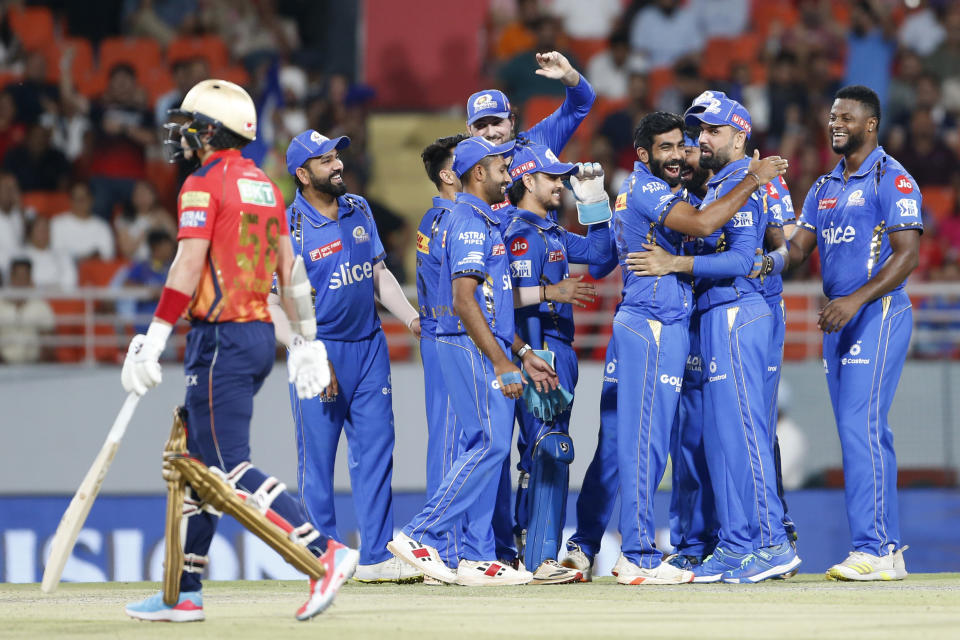 Mumbai Indians' Jasprit Bumrah , third from right, celebrates the dismissal of Punjab Kings' Sam Curran, left, during the Indian Premier League cricket match between Punjab Kings' and Mumbai Indians' in Mullanpur ,India, Thursday, April 18, 2024.(AP Photo/ Surjeet Yadav))