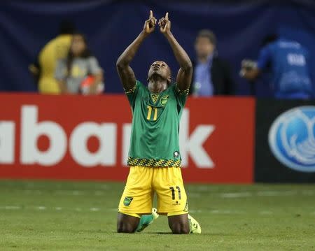 Jamaica forward Darren Mattocks (11) reacts after scoring a goal against the United States in the first half during the CONCACAF Gold Cup semifinal match at Georgia Dome. Mandatory Credit: Jason Getz-USA TODAY Sports