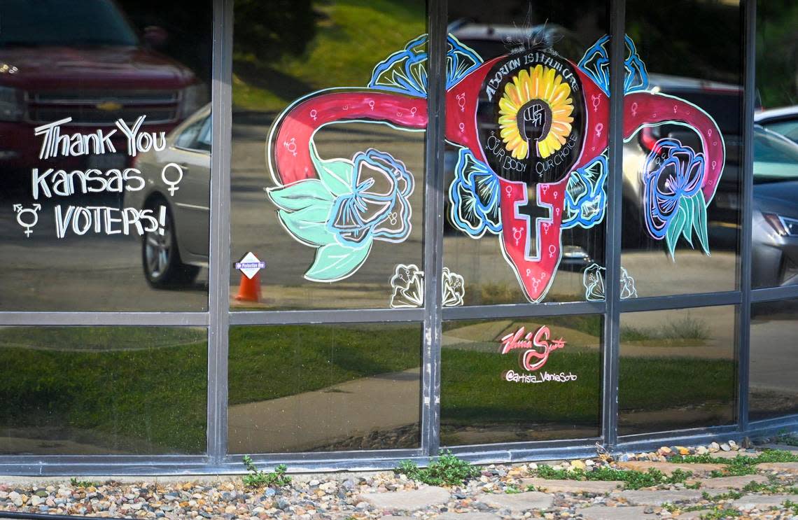 A mural thanking voters for defeating a challenge to the constitutional right to an abortion in Kansas decorates a front window at Planned Parenthood in Overland Park.