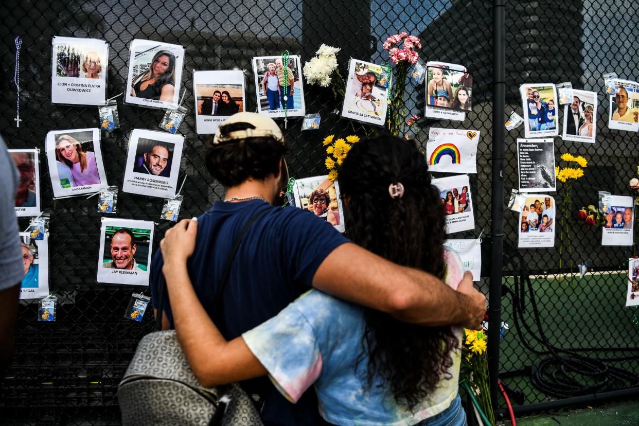 People visit the makeshift memorial