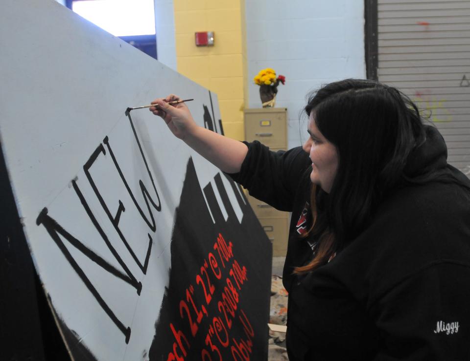 Barnstable High School drama club member Miguel Munoz, one of several seniors in their last show,  paints the roadside sign for "Newsies." The musical is based on the real-life 1899 news carrier strike that ensued after Joseph Pulitzer raised the price of newspapers the boys were buying to sell. Barnstable High's production is March 21-23. To see more photos, go to www.capecodtimes.com/.